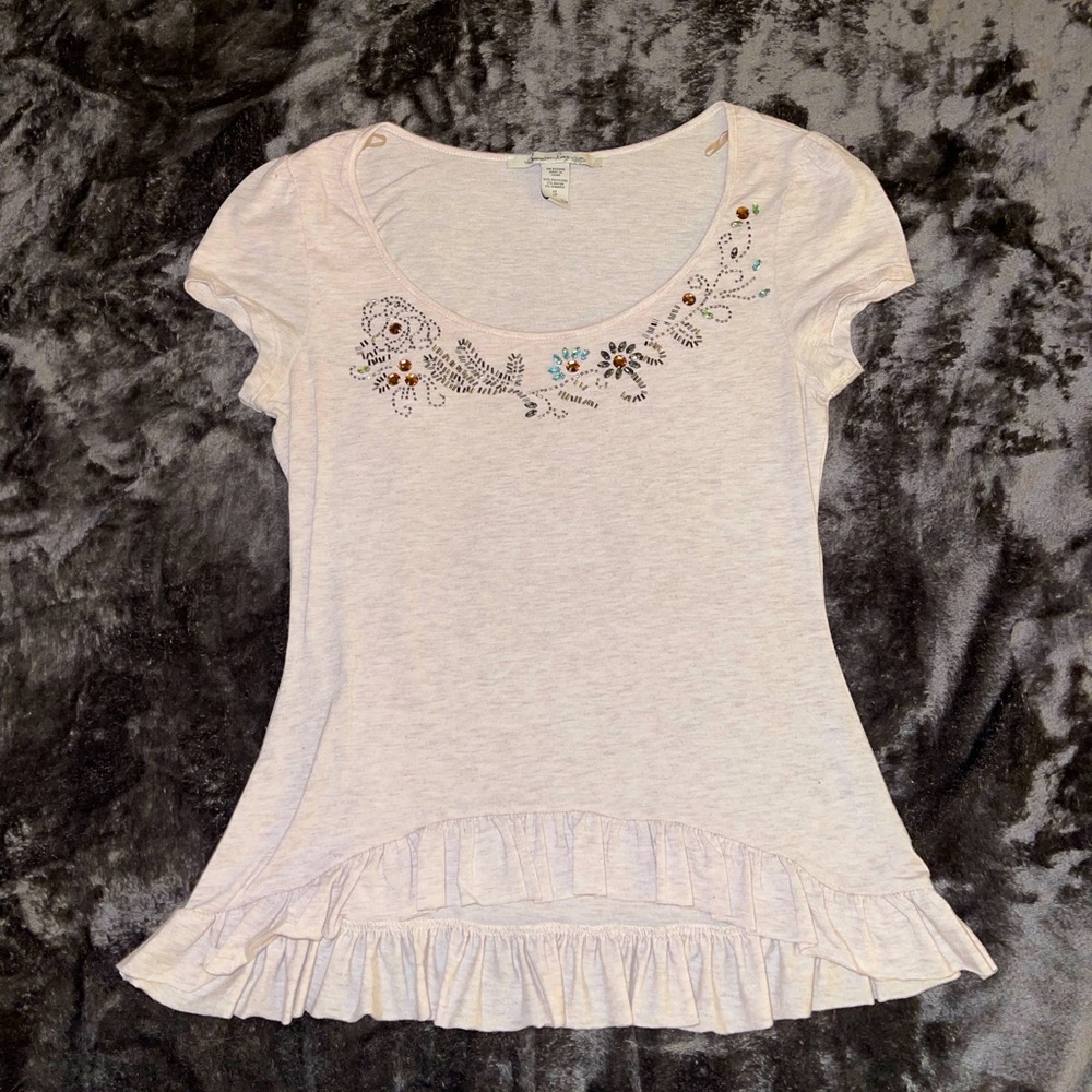 Gray short sleeve shirt with ruffle and jewel accents